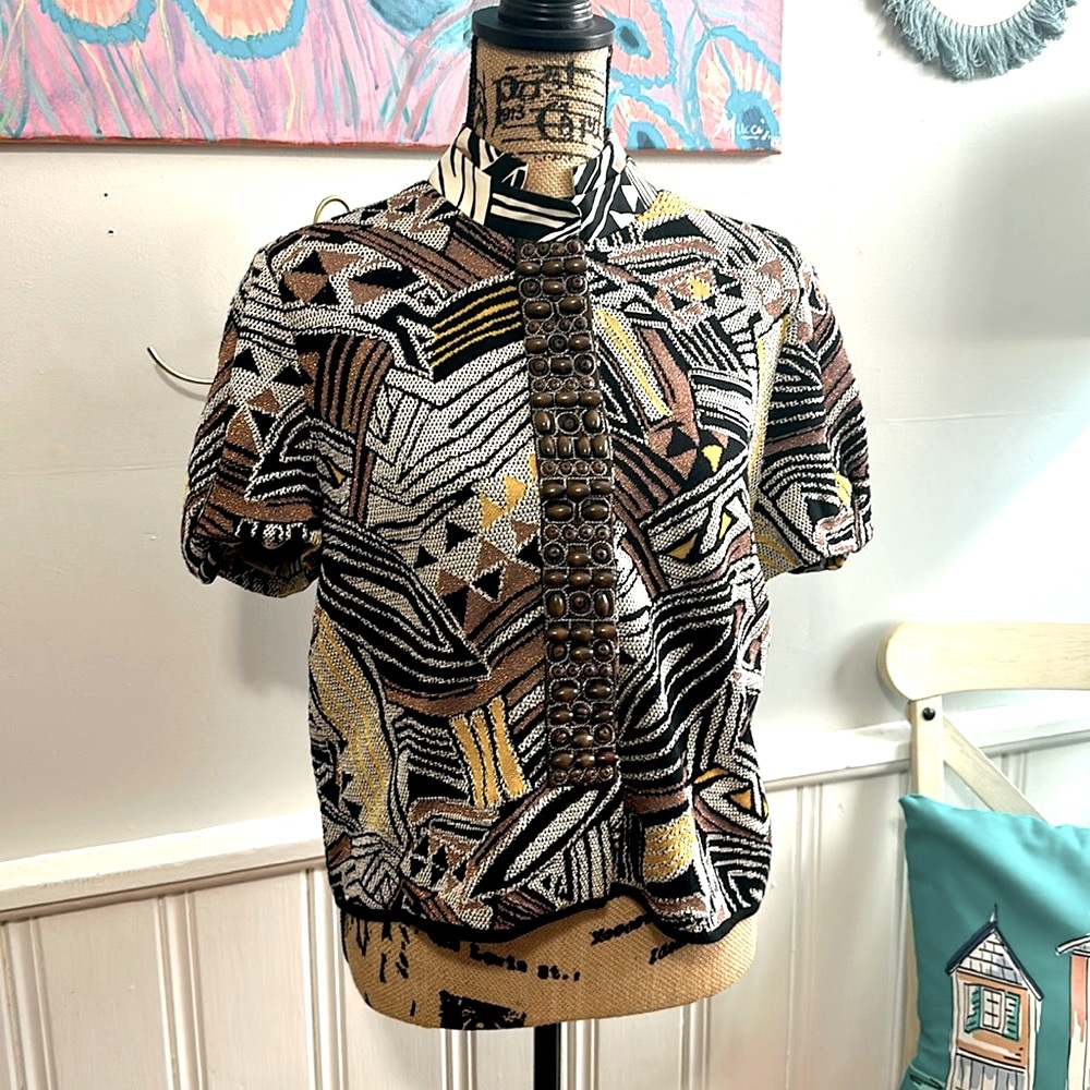 St. John SoCa knit tribal knit with wood beads down closure panel.